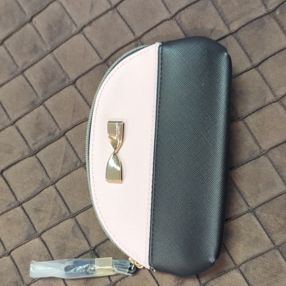 Victoria Secret NWOT change purse. Very cute pink and black